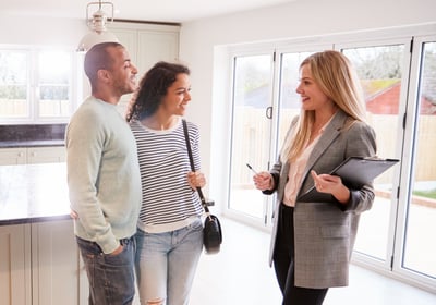 Real Estate Agent talking to customers