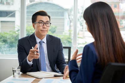 Financial Manager talking to client