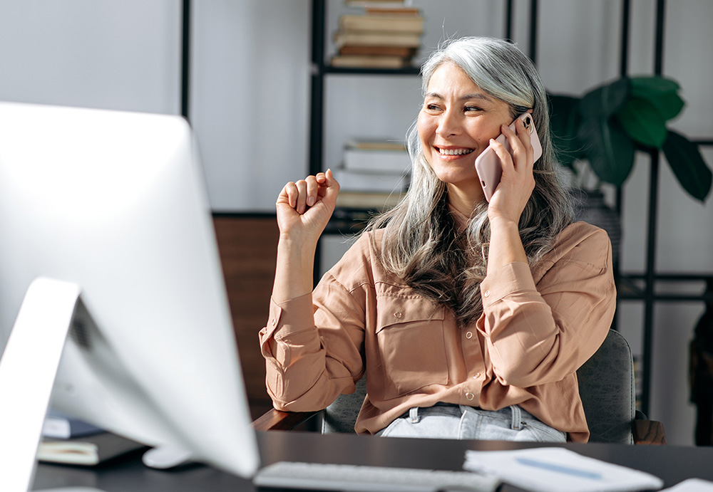 Happy compliance officer on the phone